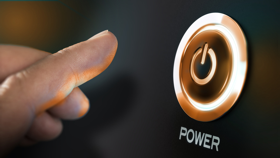 Finger about to press a power button. Hardware equipment concept. Composite between an image and a 3D background